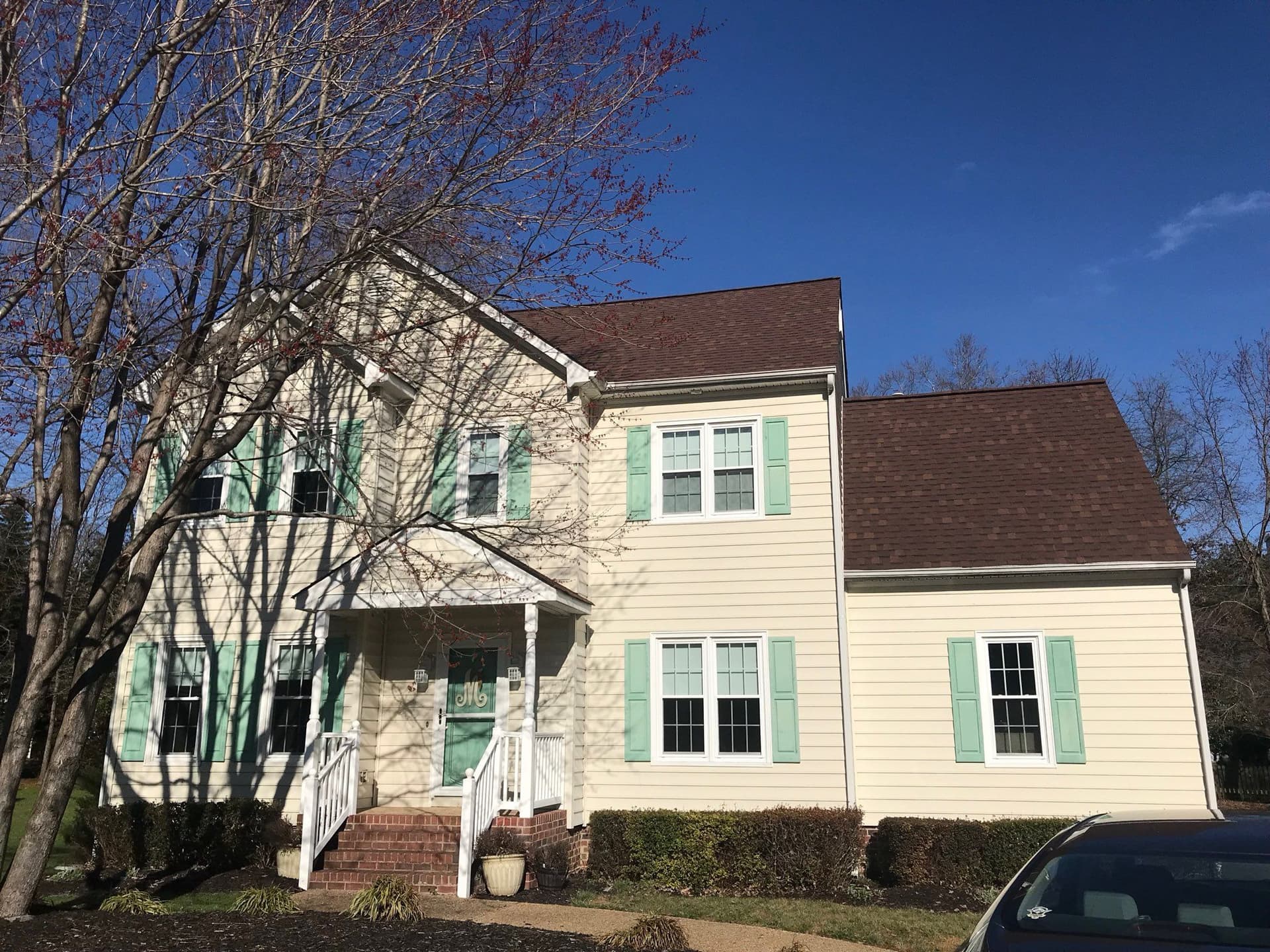 Beige Siding with Green Shutters Home Makeover image