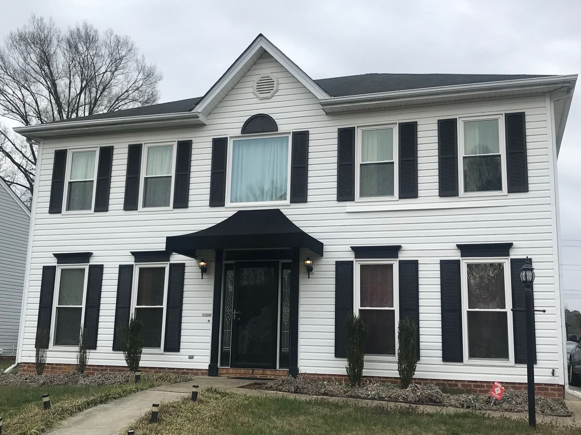 Elegant Black Roof and Siding Upgrade image